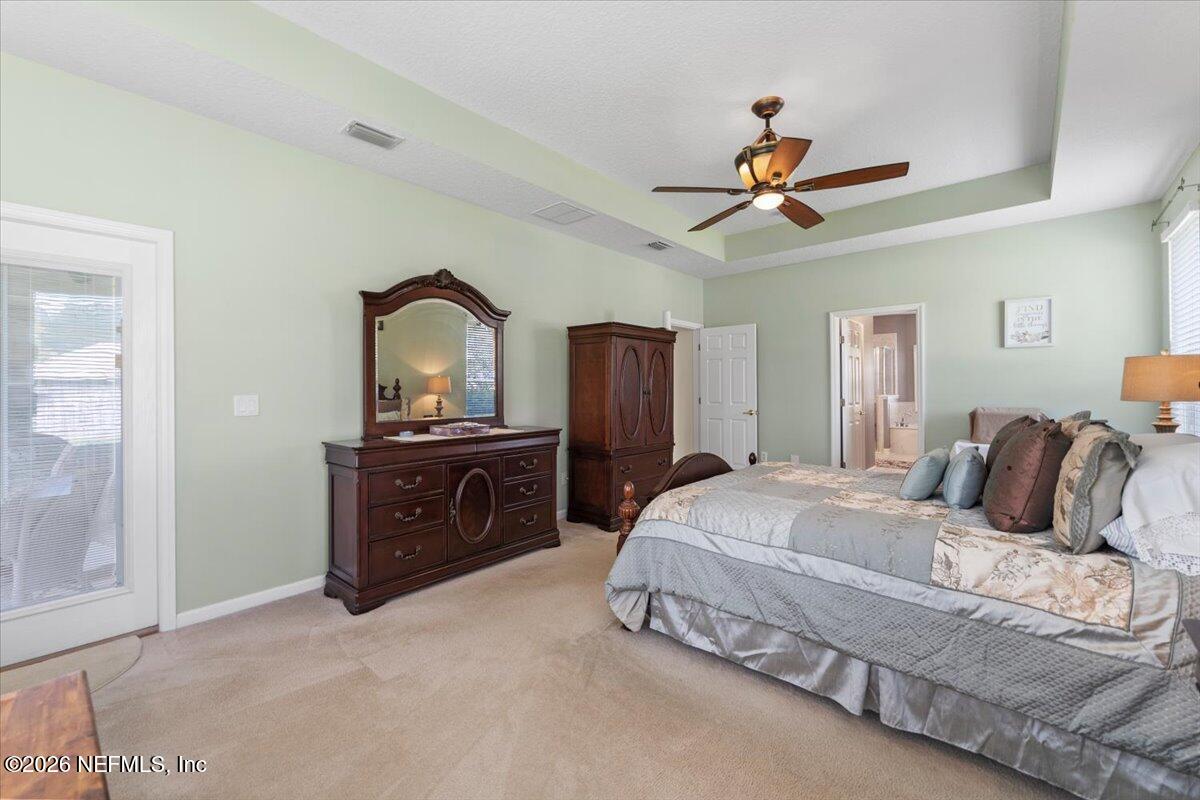 1112 Hawk Watch Circle St. Augustine, FL 32092 - Photo 39 of 49 a bedroom with a bed and a dresser