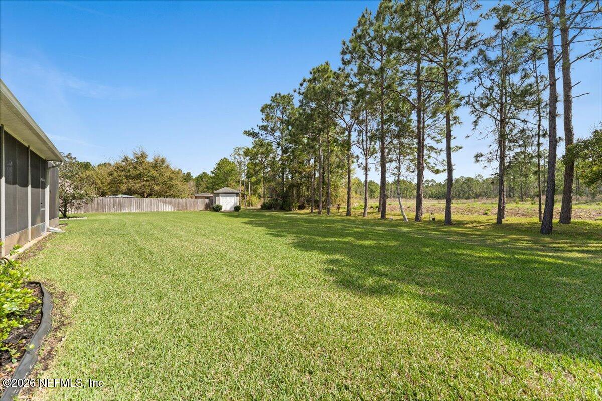 1112 Hawk Watch Circle St. Augustine, FL 32092 - Photo 40 of 49 a view of yard with trees and grass