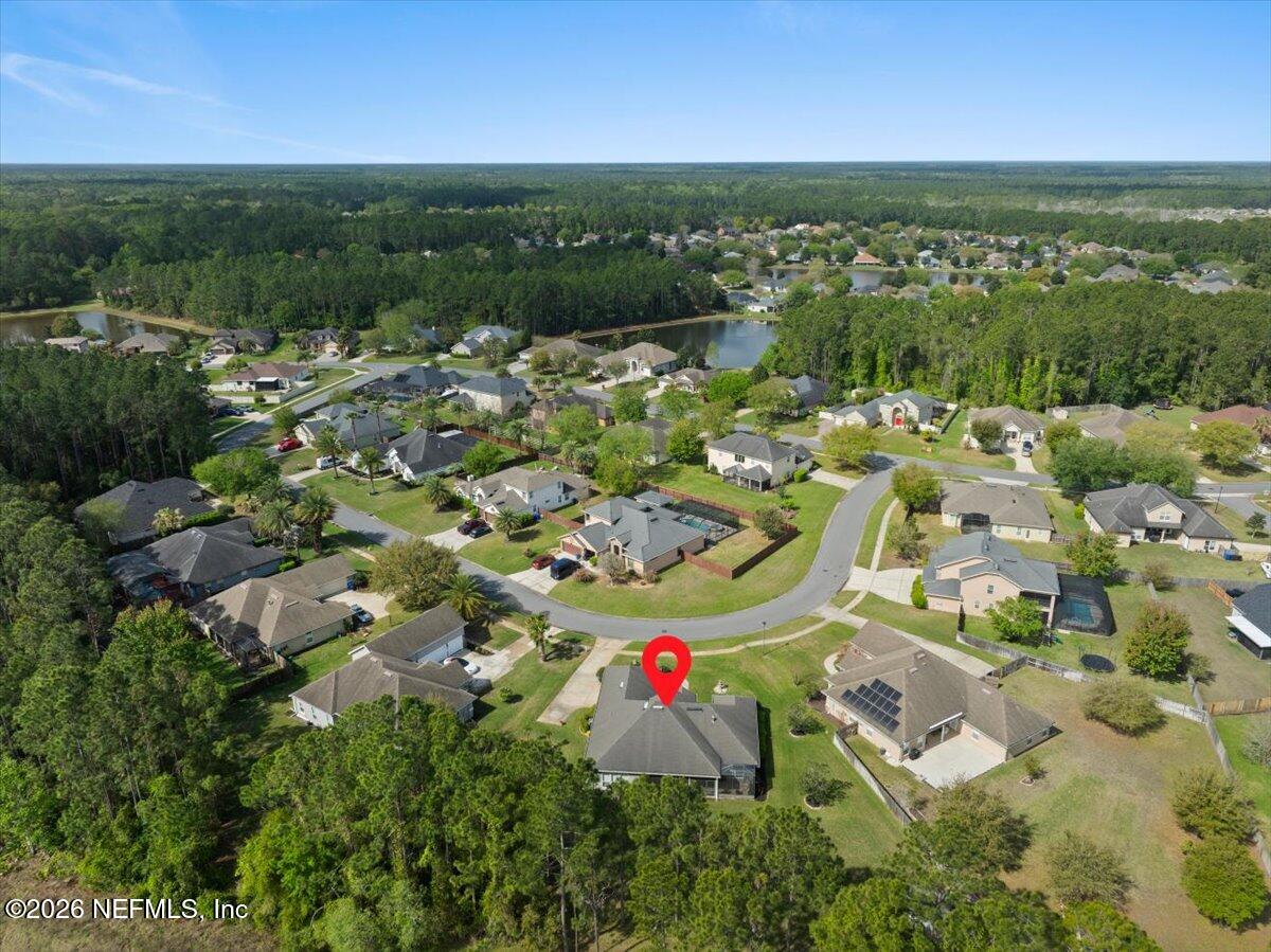 1112 Hawk Watch Circle St. Augustine, FL 32092 - Photo 46 of 49 an aerial view of residential houses with outdoor space and trees