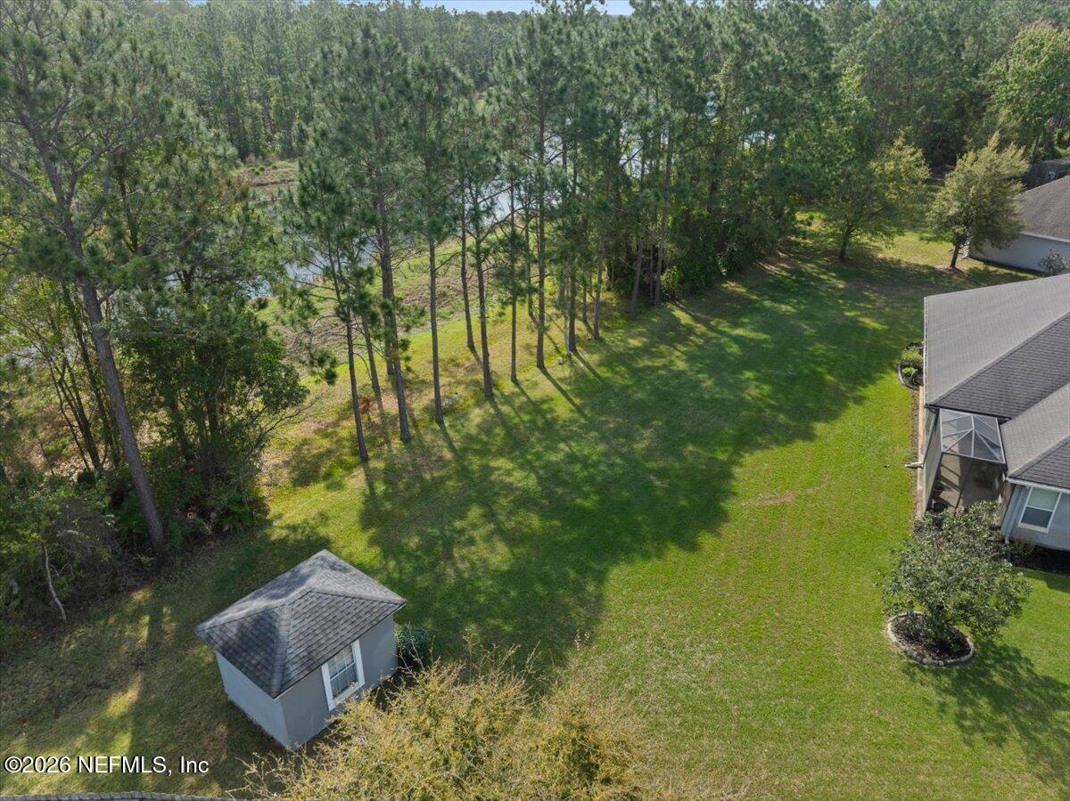 1112 Hawk Watch Circle St. Augustine, FL 32092 - Photo 49 of 49 a backyard of a house with a yard and outdoor seating