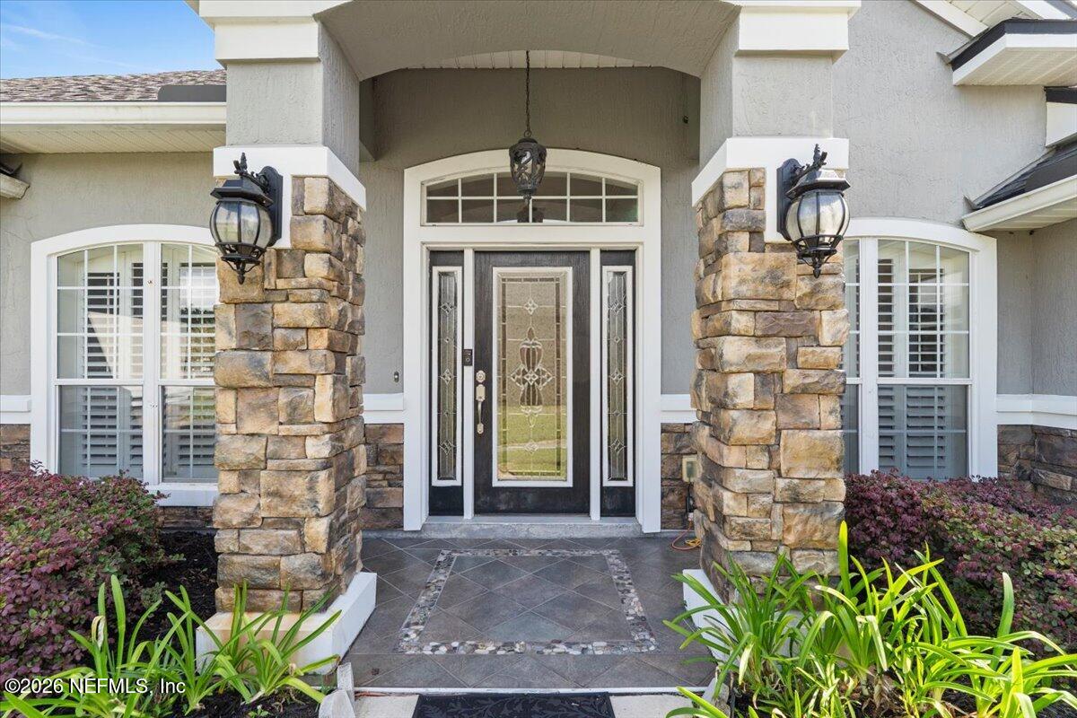 1112 Hawk Watch Circle St. Augustine, FL 32092 - Photo 6 of 49 a front view of a house with glass windows