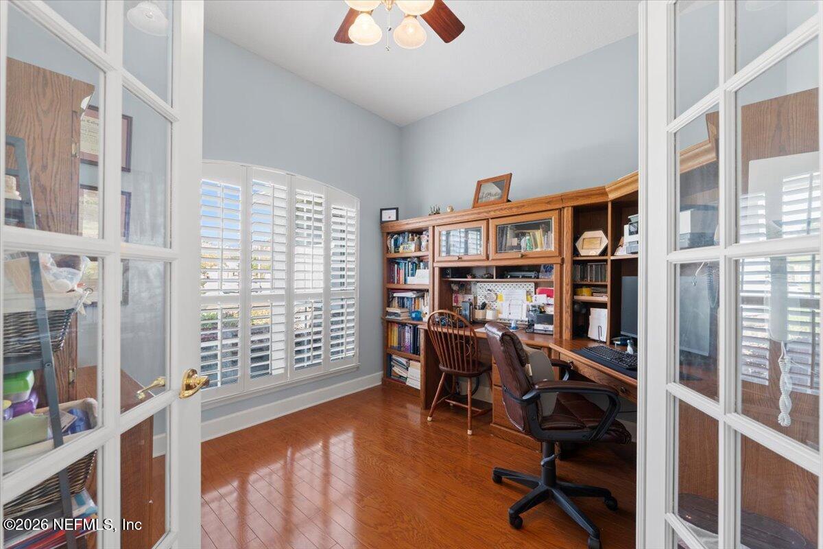 1112 Hawk Watch Circle St. Augustine, FL 32092 - Photo 8 of 49 a view of a workspace with furniture and a large window