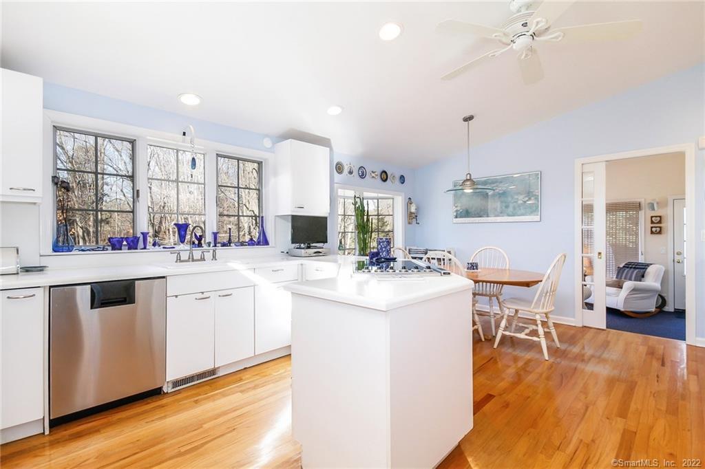 120 Cedar Road Fairfield, CT 06890 - Photo 1 of 1 a kitchen with a sink and wooden floor