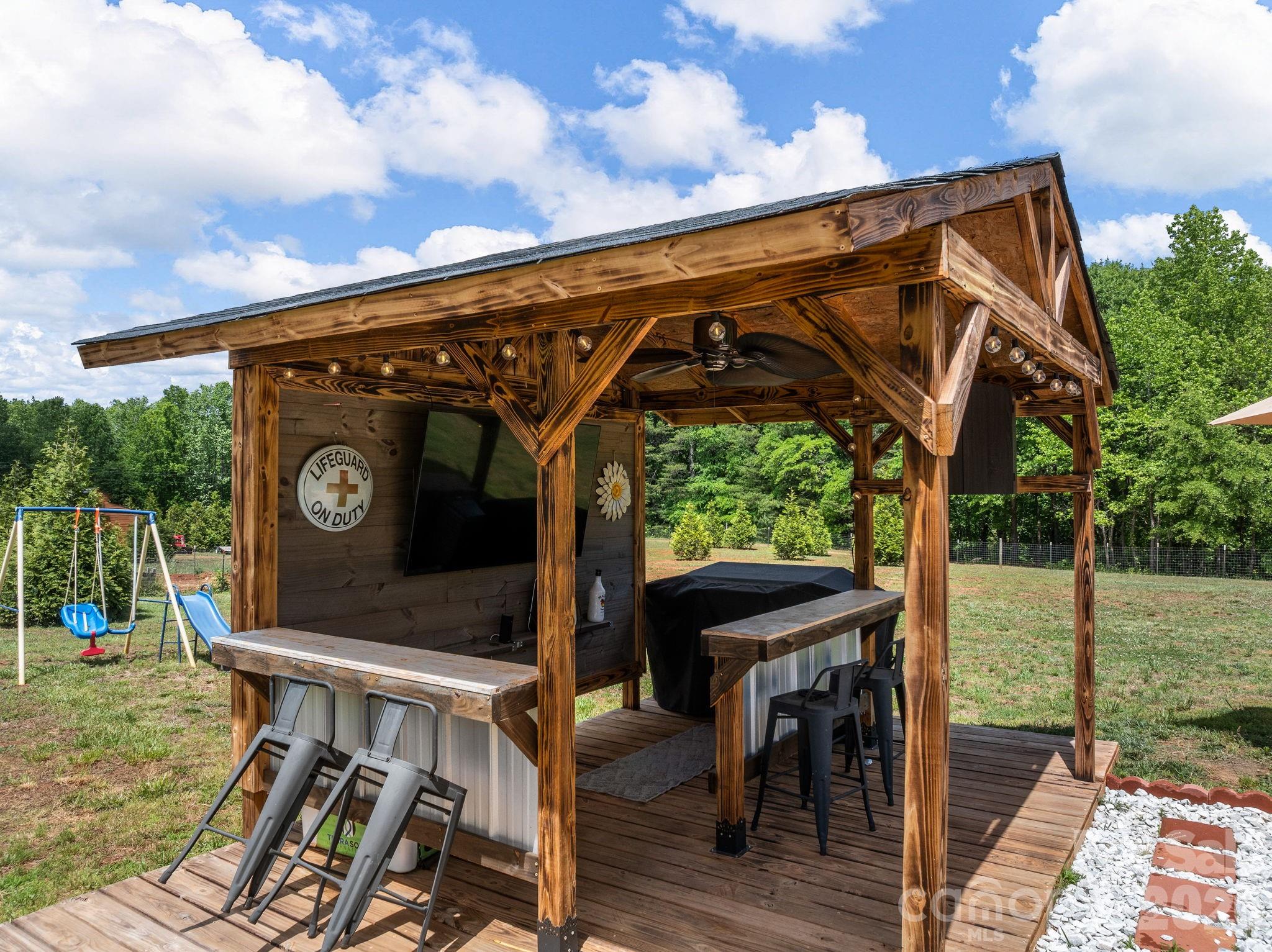 1076 McSwain Road Chesnee, SC 29323 - Photo 33 of 36 a view of a chairs and table in the patio