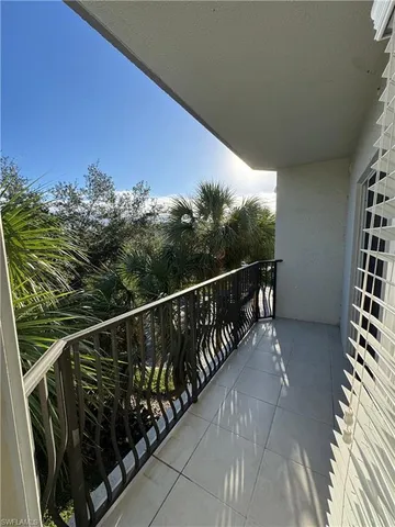 a view of balcony with furniture