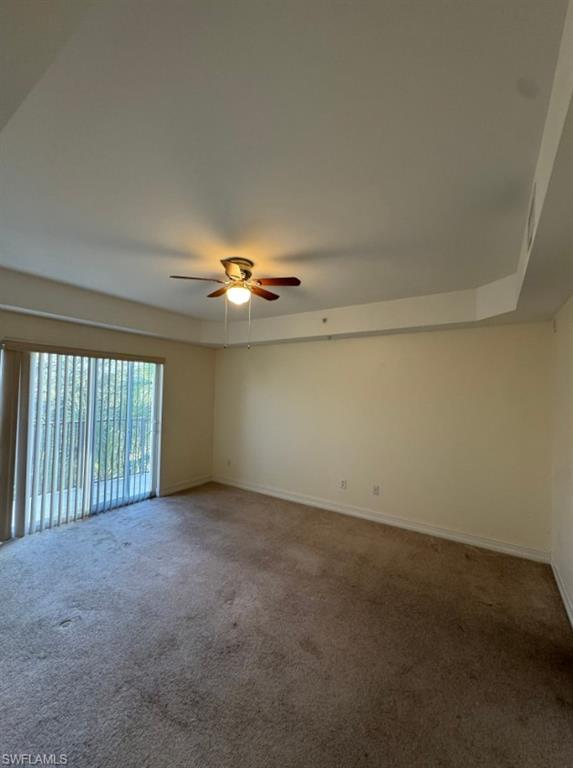 1100 Pine Ridge Road, Unit A302 Naples, FL 34108 - Photo 4 of 12 an empty room with windows