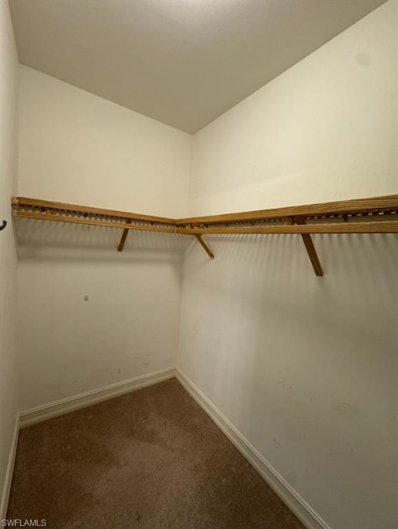 1100 Pine Ridge Road, Unit A302 Naples, FL 34108 - Photo 8 of 12 a view of a room with racks on the wall