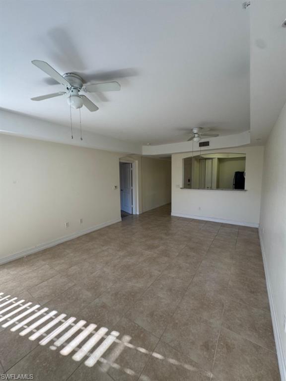 1100 Pine Ridge Road, Unit A302 Naples, FL 34108 - Photo 10 of 12 an empty room with a empty space and windows
