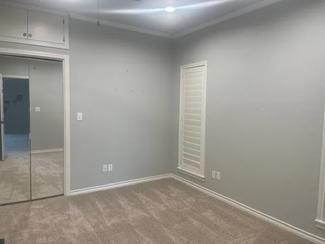 a bathroom with a shower a toilet and a sink