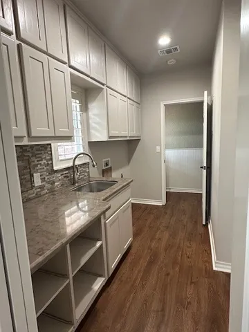 a view of empty room with windows