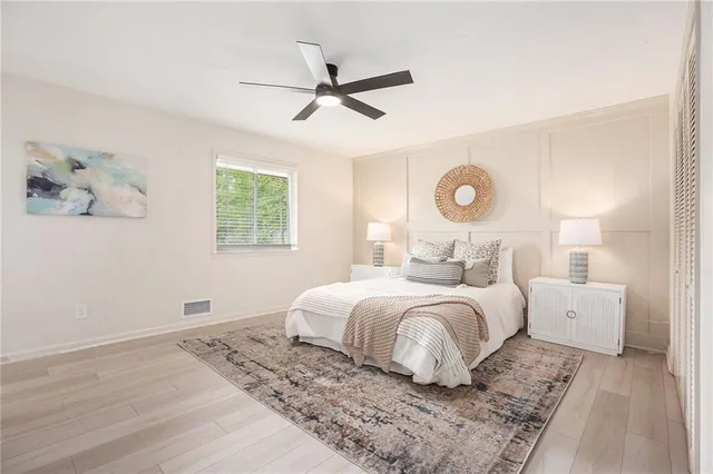 a bedroom with bed and a window