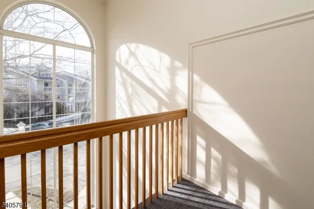 a view of balcony with wooden floor