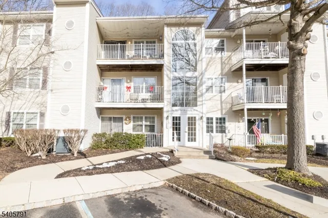 a view of a brick building next to a road