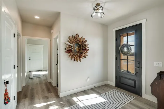 a view of entryway with wooden floor