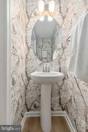 a bathroom with a sink and mirror