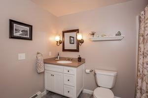 346 Phillips Road Sandwich, MA 02562 - Photo 14 of 16 a bathroom with a toilet sink vanity granite and mirror