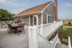 346 Phillips Road Sandwich, MA 02562 - Photo 7 of 16 a balcony with table and chairs