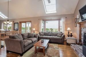 346 Phillips Road Sandwich, MA 02562 - Photo 9 of 16 a living room with furniture and a large window