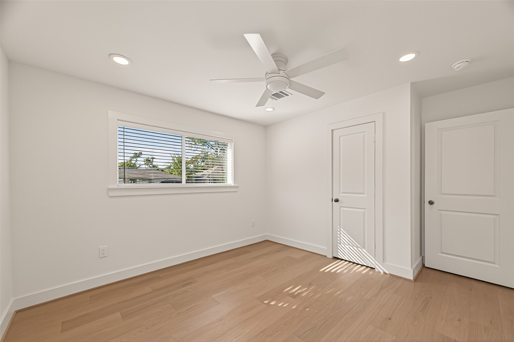 9242 Autauga Street Houston, TX 77080 - Photo 28 of 49 wooden floor in an empty room with a window