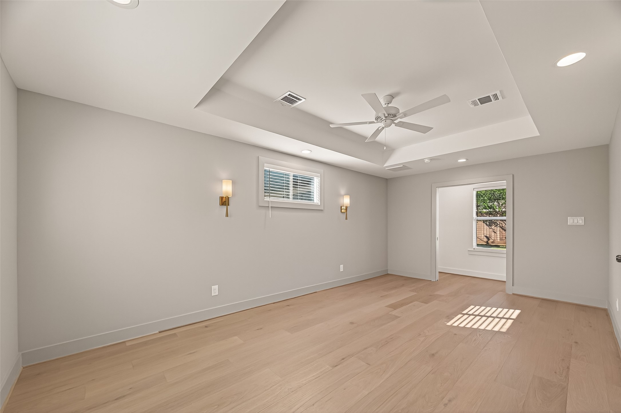 9242 Autauga Street Houston, TX 77080 - Photo 37 of 49 an empty room with a ceiling fan and a window