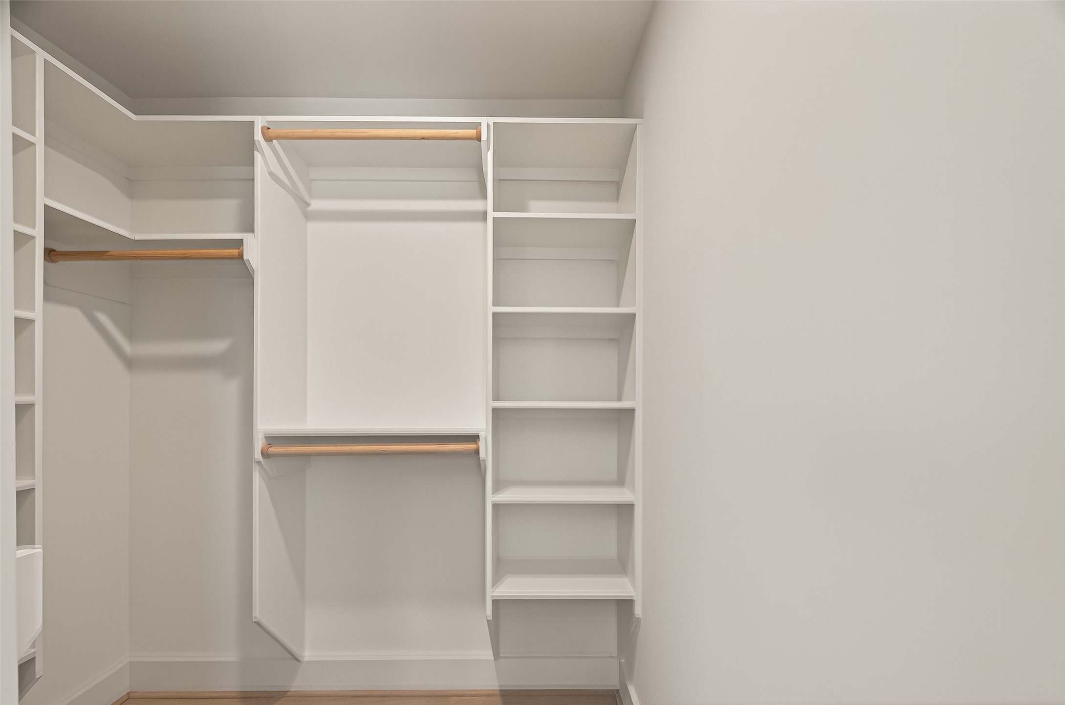 9242 Autauga Street Houston, TX 77080 - Photo 40 of 49 a view of walk in closet with empty racks