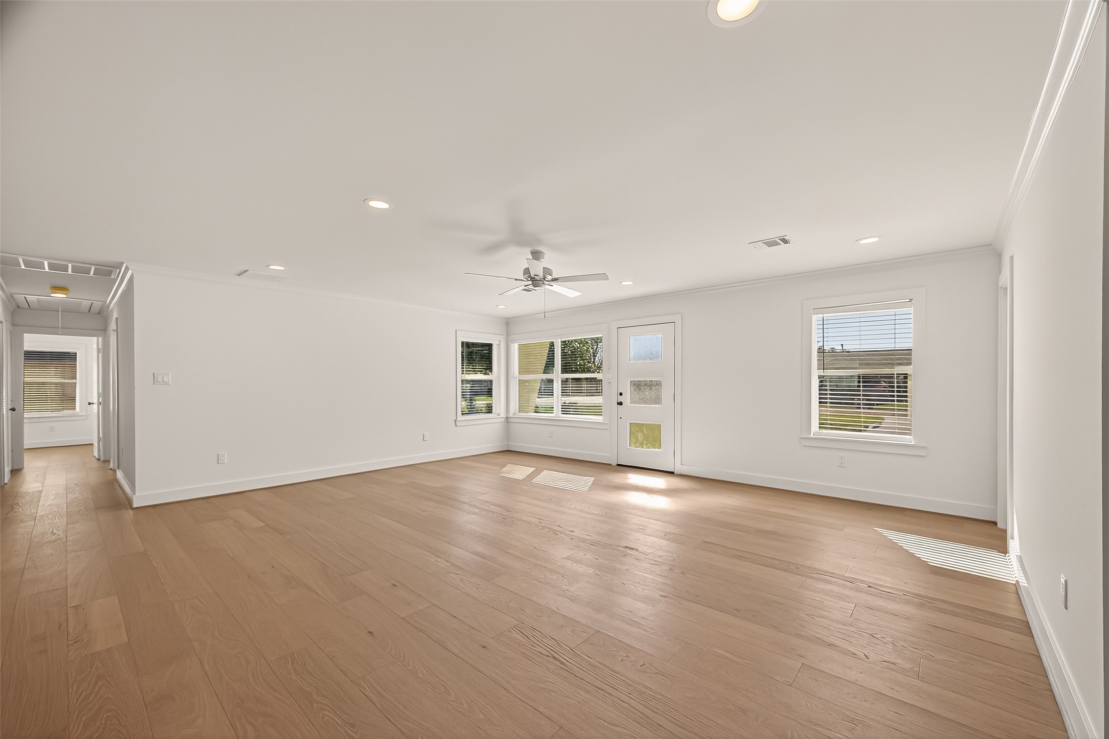 9242 Autauga Street Houston, TX 77080 - Photo 7 of 49 wooden floor in an empty room with a window