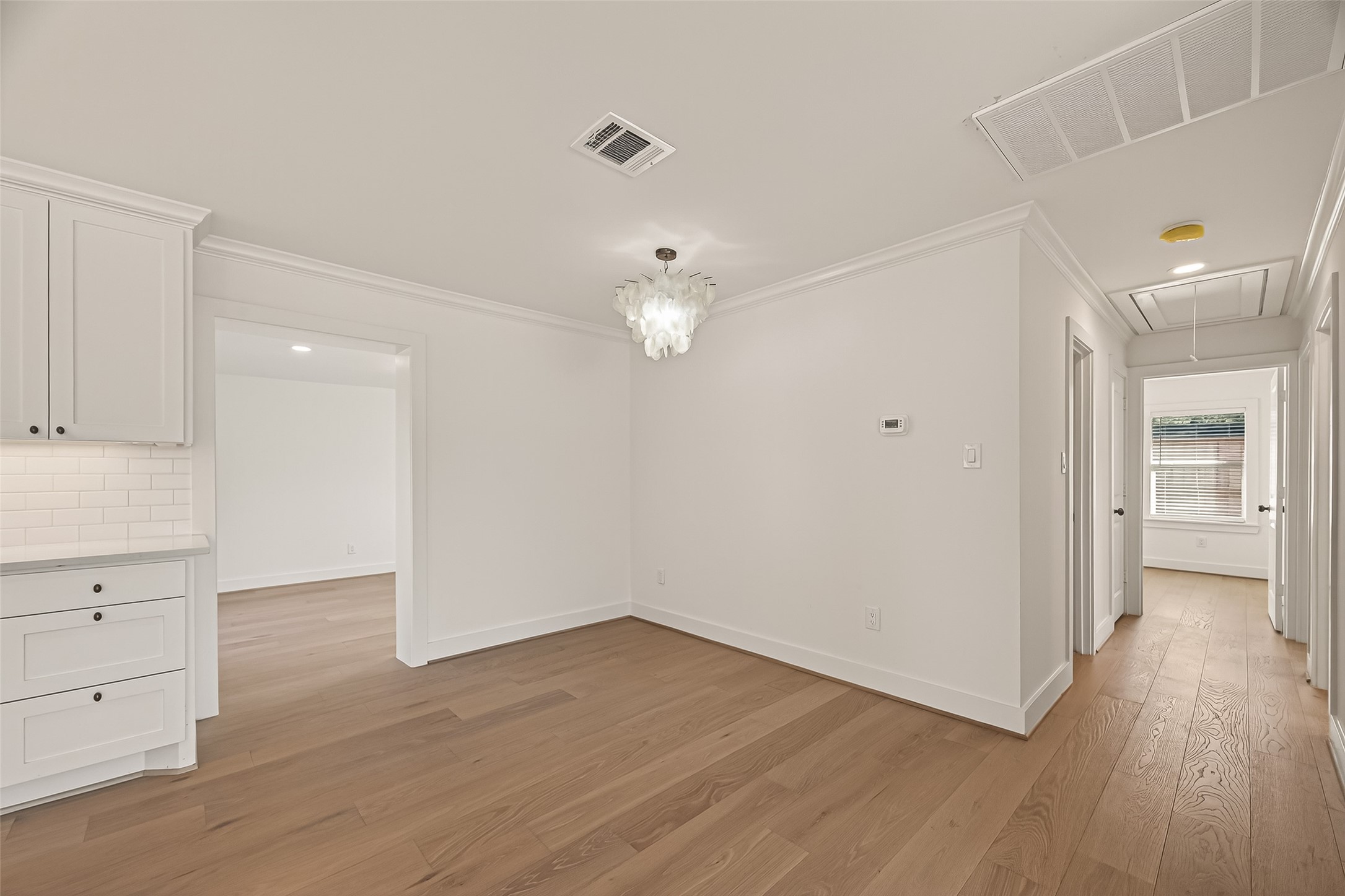 9242 Autauga Street Houston, TX 77080 - Photo 10 of 49 wooden floor in an empty room with a window