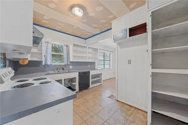 a kitchen with stainless steel appliances granite countertop a stove and a refrigerator