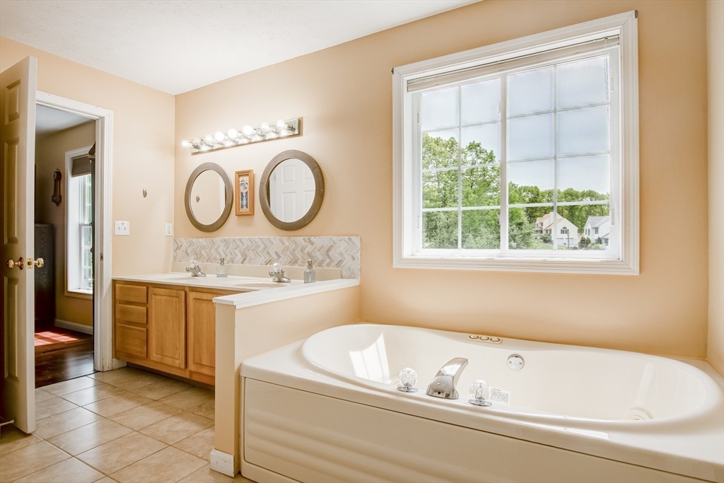 6 Loon Road Winchendon, MA 01475 - Photo 18 of 36 a bathroom with a granite countertop sink and a bathtub