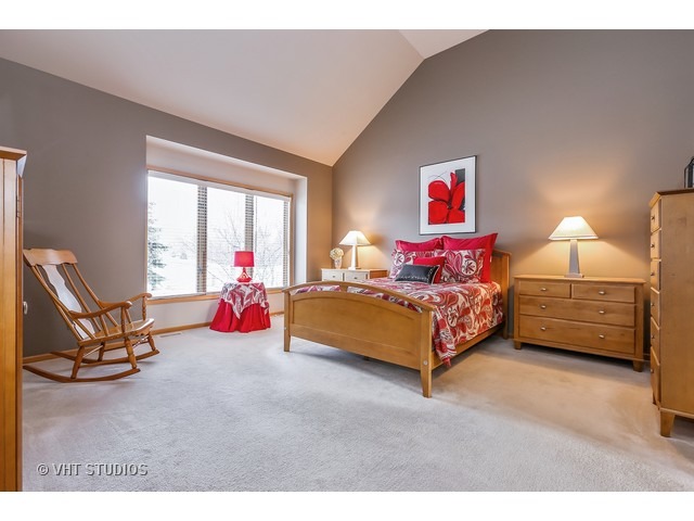 10808 West Riviera Drive Spring Grove, IL 60081 - Photo 7 of 16 a bedroom with a bed and a couch