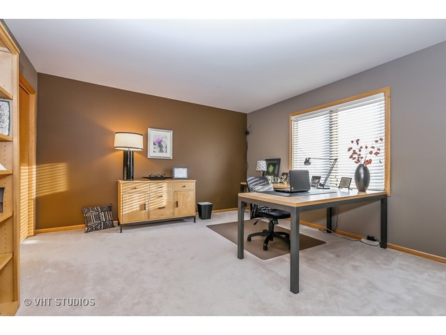 10808 West Riviera Drive Spring Grove, IL 60081 - Photo 10 of 16 a living room with furniture a table and a window