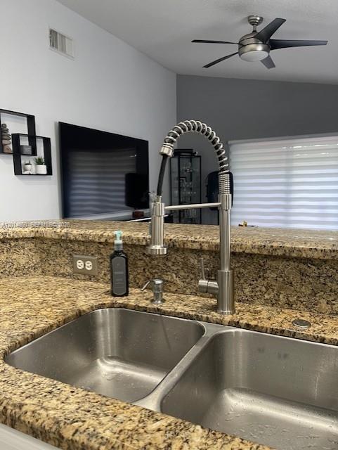 16654 Southwest 103rd Lane Miami, FL 33196 - Photo 6 of 20 a view of a kitchen counter top a sink and cabinets