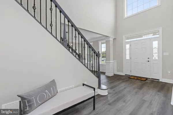 a view of an entryway with wooden floor