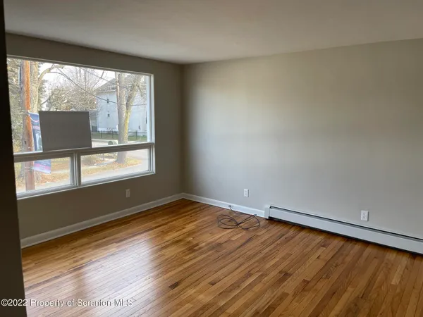a view of an empty room and window