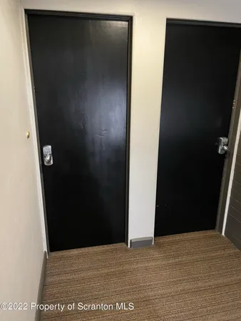 an empty room with wooden floor