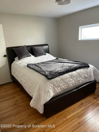 a bedroom with a bed and closet