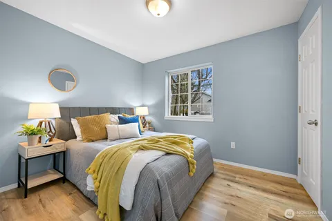 a bedroom with a bed and window