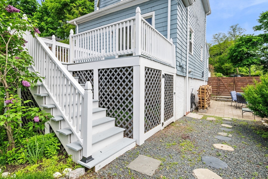 8 Baker Avenue Beverly, MA 01915 - Photo 32 of 40 a view of a house with wooden fence and porch