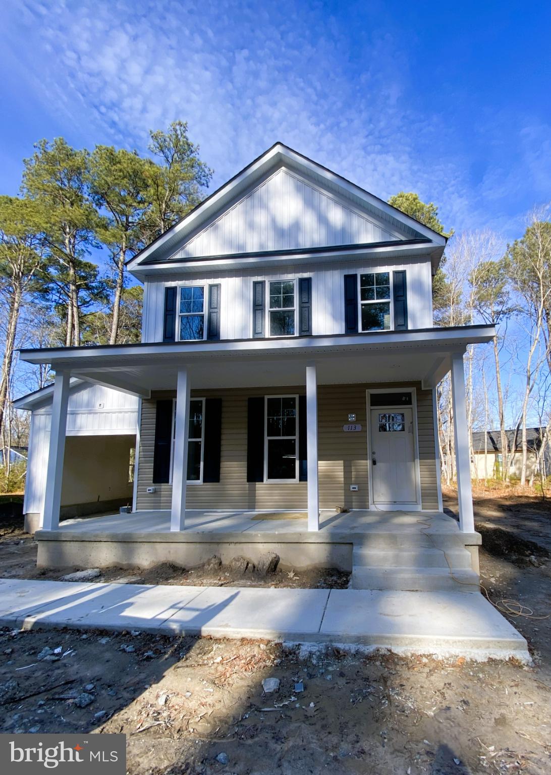 113 Laurel Lane Colonial Beach, VA 22443 - Photo 2 of 6 a front view of a house with yard and furniture