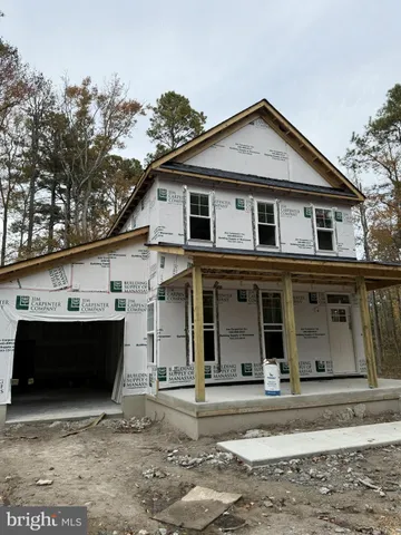 a front view of a house with a garage