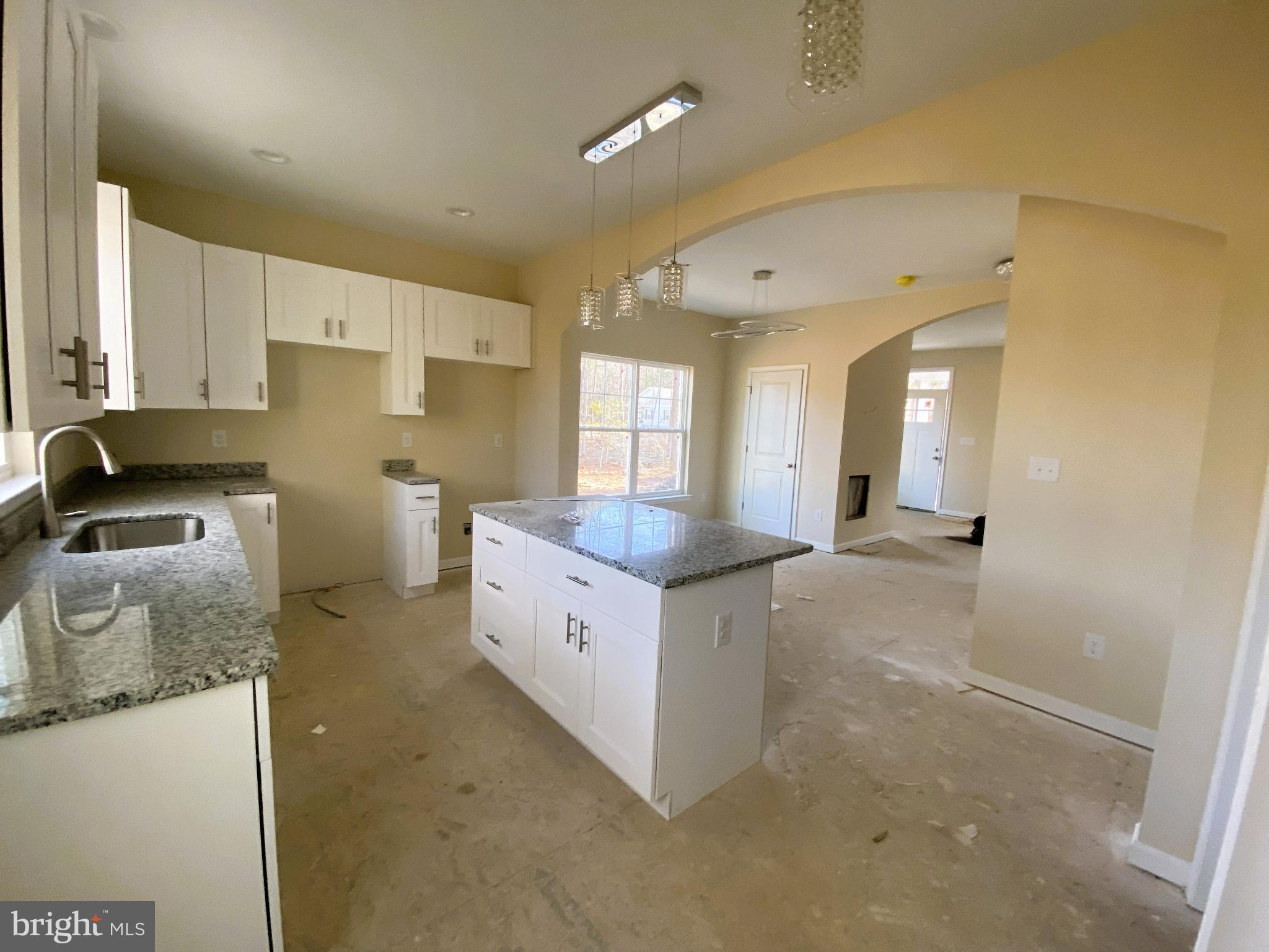 113 Laurel Lane Colonial Beach, VA 22443 - Photo 3 of 6 a kitchen with granite countertop a sink and a stove top oven