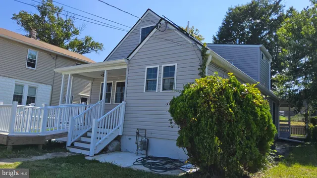 a bathroom with a toilet a sink and a mirror