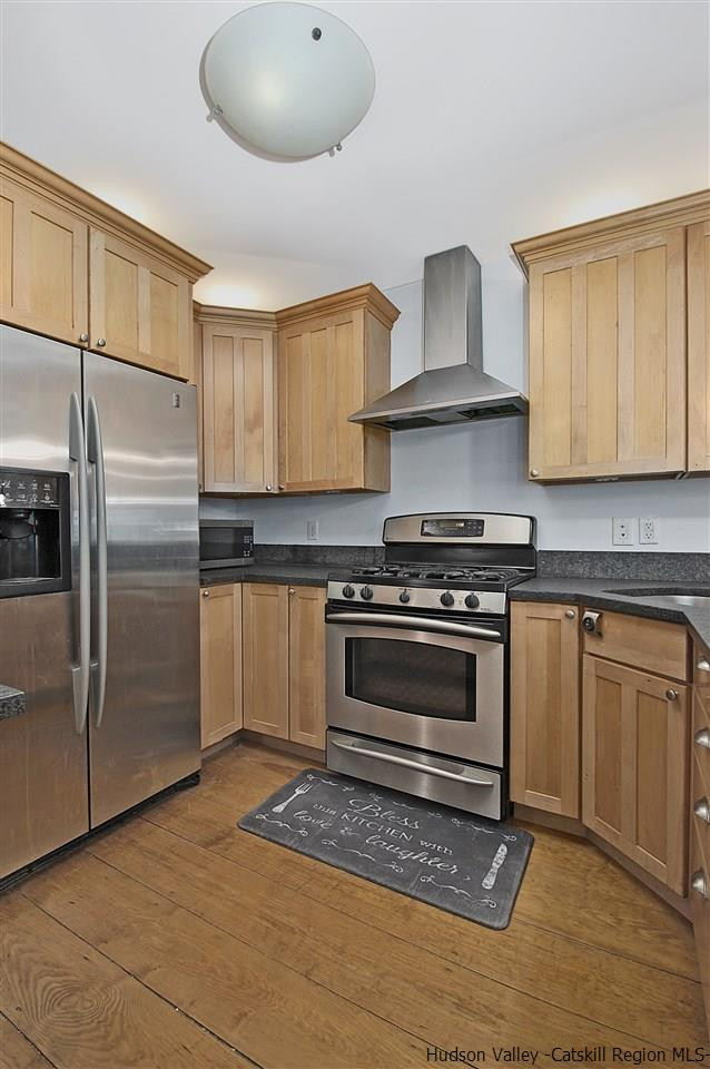 522 Buck Road Stone Ridge, NY 12484 - Photo 11 of 30 a kitchen with granite countertop a stove and a refrigerator