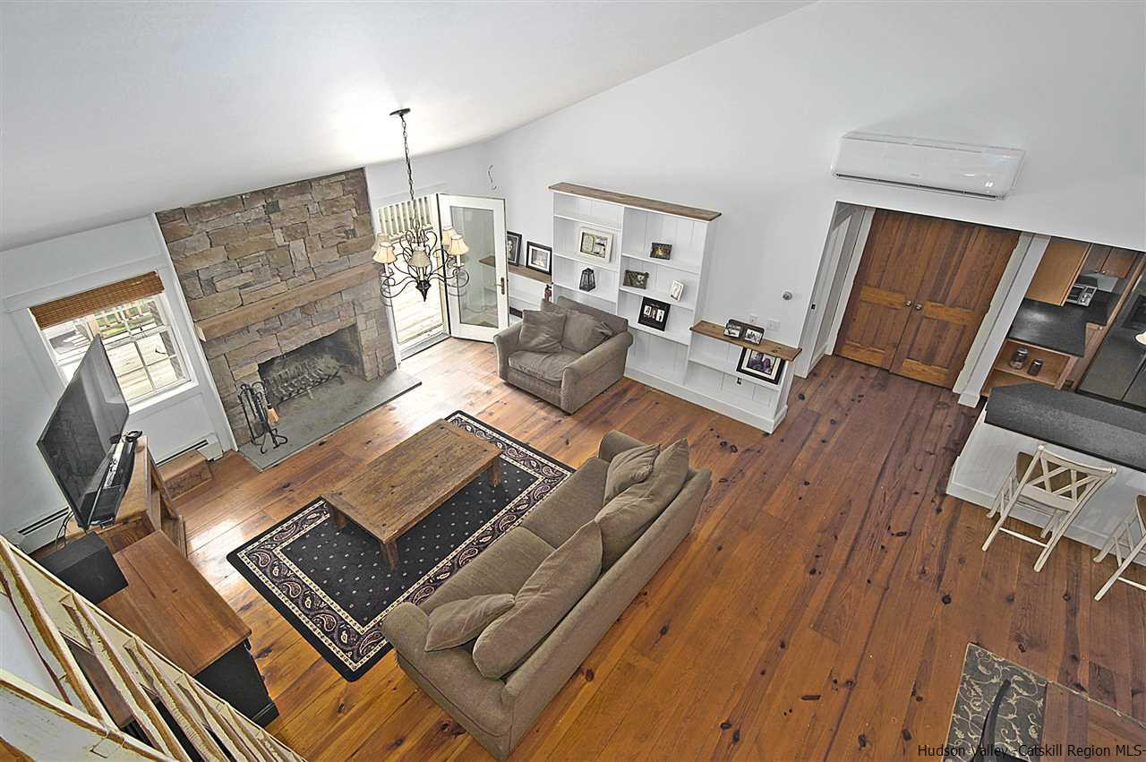522 Buck Road Stone Ridge, NY 12484 - Photo 15 of 30 a living room with furniture and a fireplace