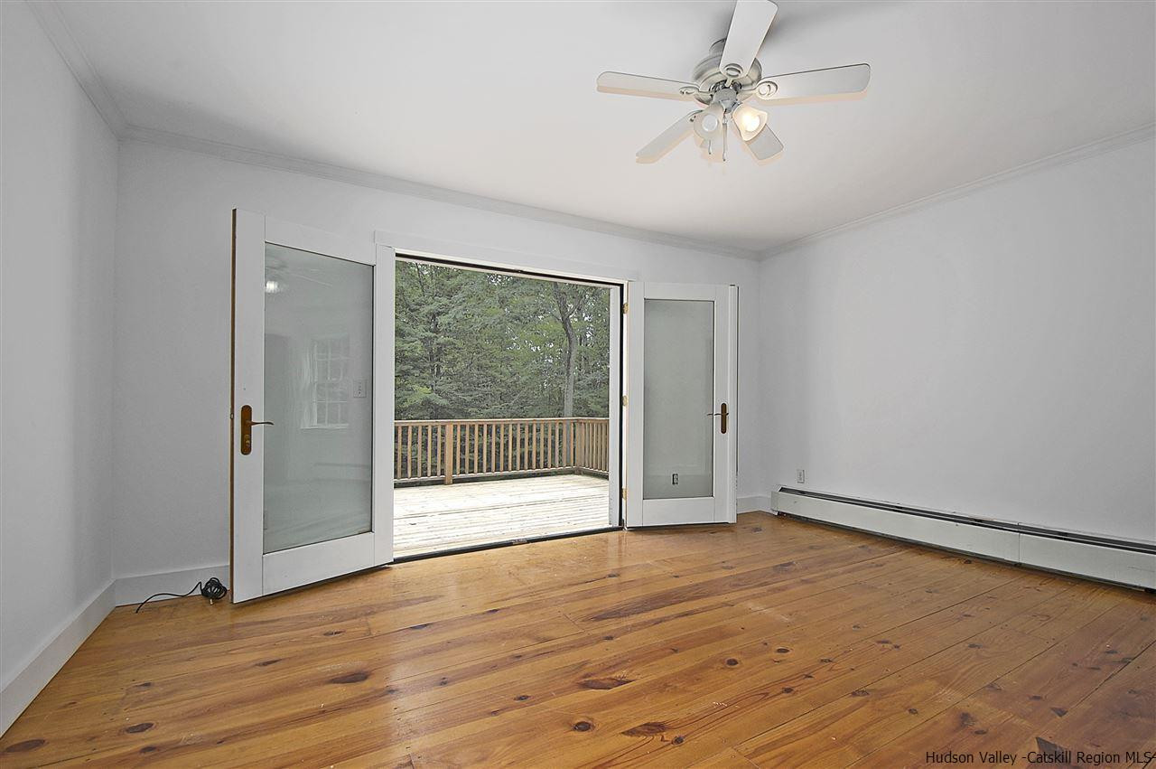 522 Buck Road Stone Ridge, NY 12484 - Photo 16 of 30 wooden floor in an empty room with a window
