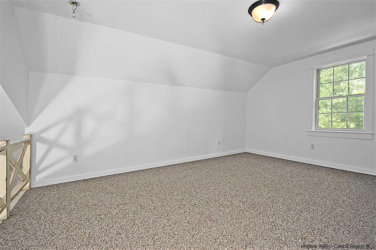 522 Buck Road Stone Ridge, NY 12484 - Photo 22 of 30 an empty room with windows
