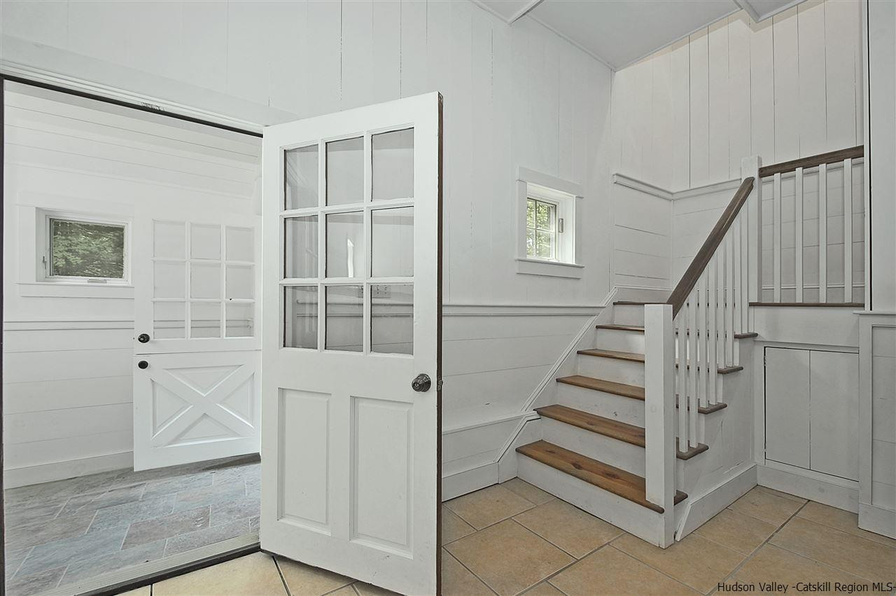 522 Buck Road Stone Ridge, NY 12484 - Photo 4 of 30 a view of entryway with wooden floor and stairs