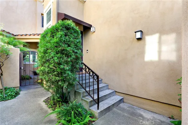 a view of entryway with wooden floor and stairs
