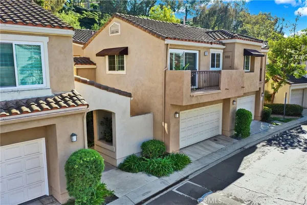 a front view of a house with yard