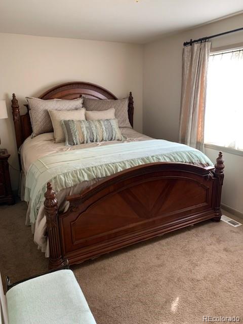 161 Saddlestring Road Bailey, CO 80421 - Photo 23 of 32 a bedroom with a bed and window